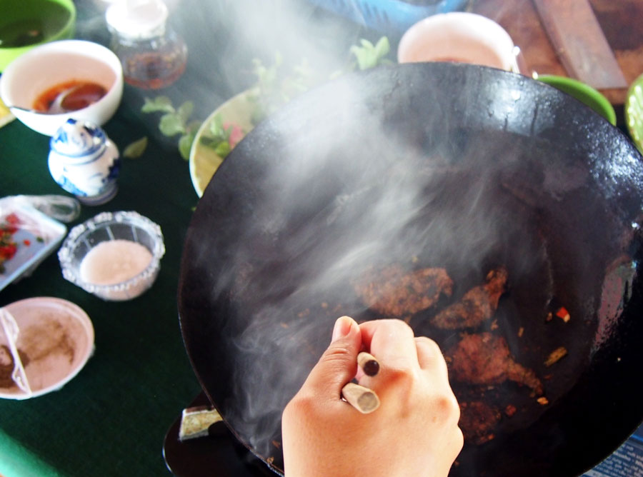 A quick fry in a searing hot wok to cook the pork